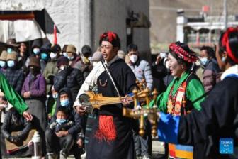 Tibet residents welcome New Year with yak stew, mask dance performances